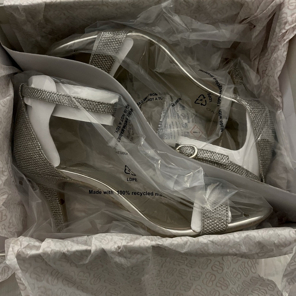 Never worn Bandolino open toed heels.